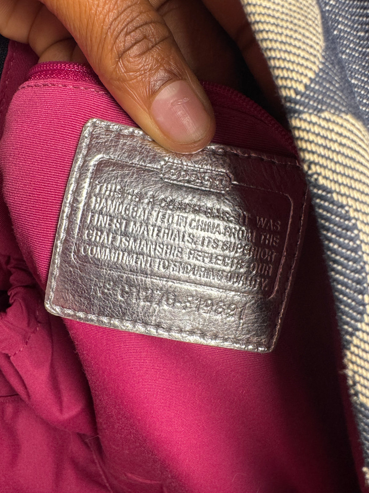 2000’s silver and denim Coach backpack